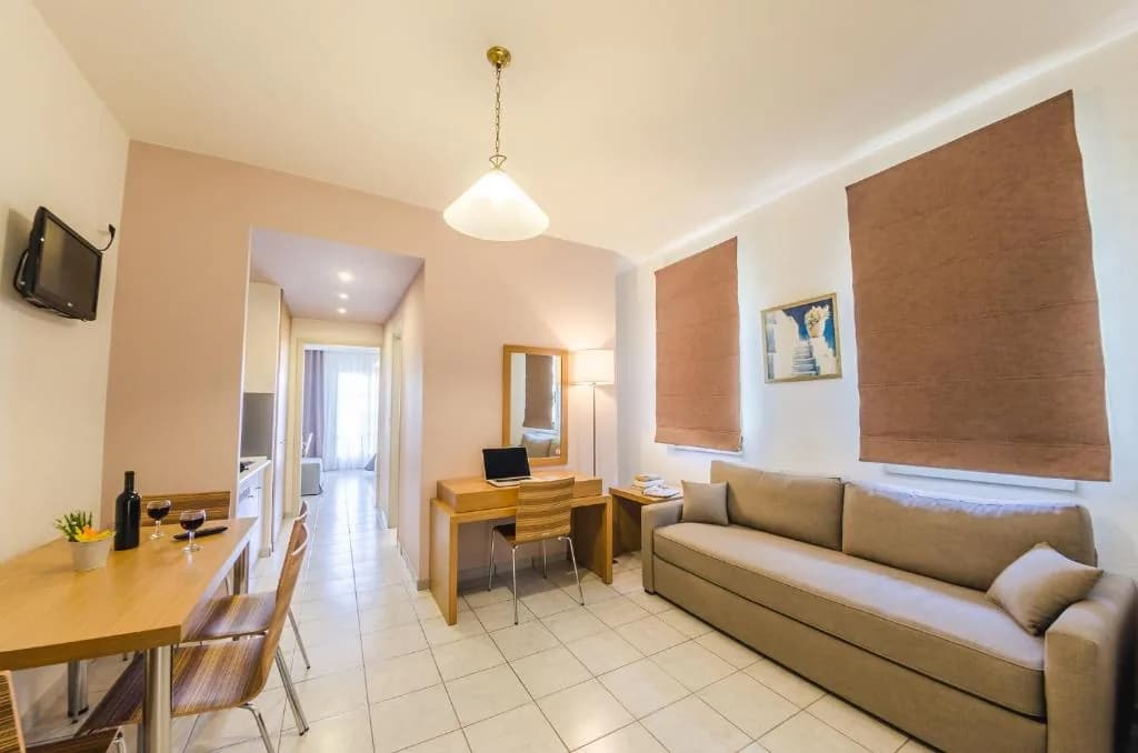 Suite living area with sofa and dining table